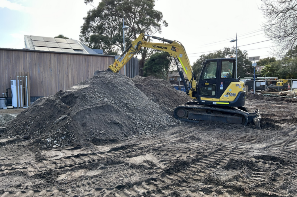 Forklift clearing the way for installation a permeable paced carpark floor.