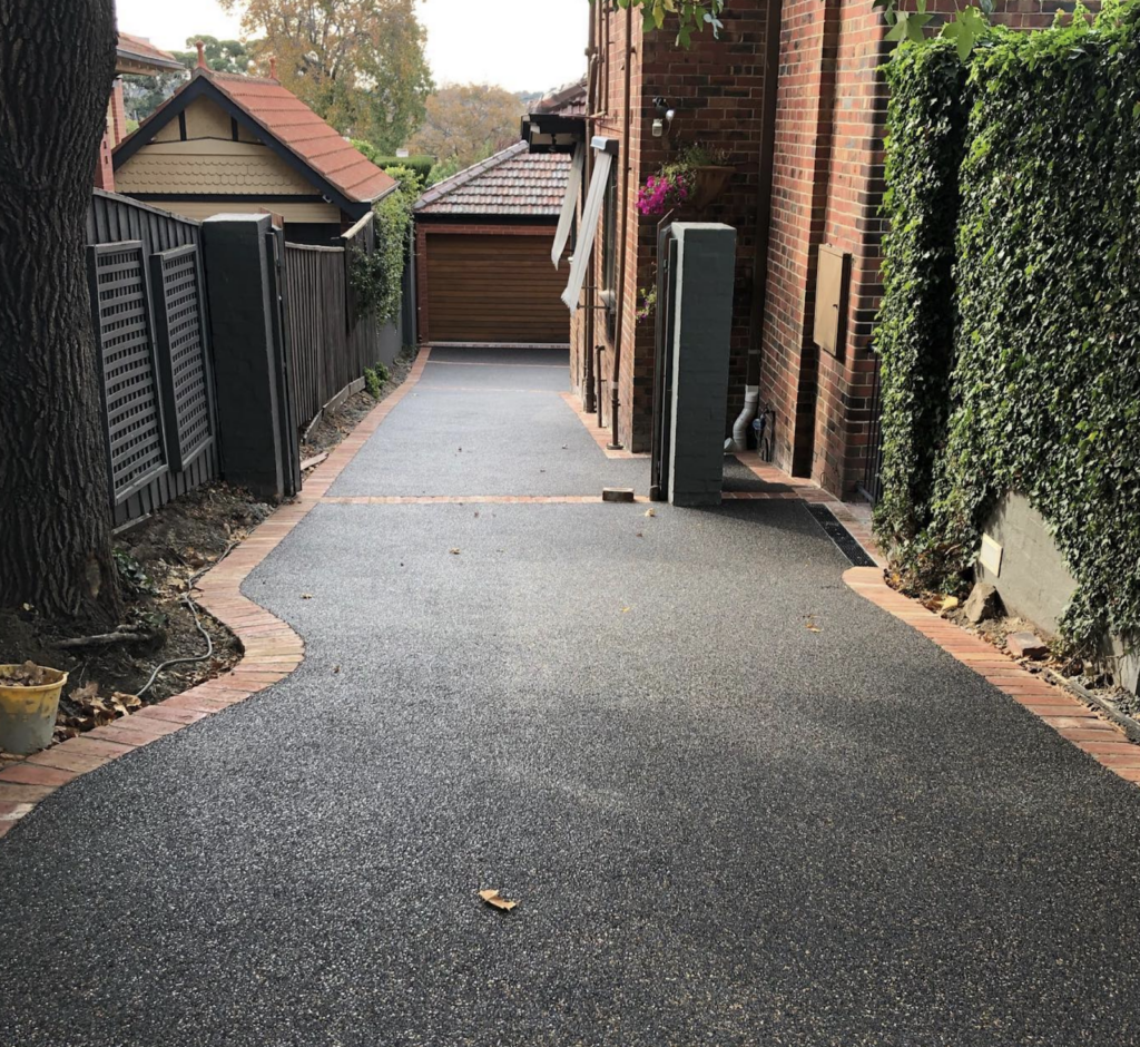 Paver colour “Midnight Gold” permeable paving with old red brick borders for a heritage brick home