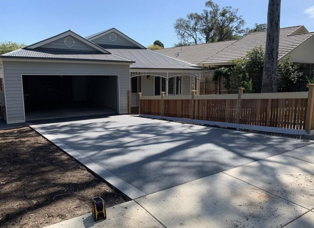 Driveway using permeable paving in colour “Silver Ash” permeable paving with a bluestone border.