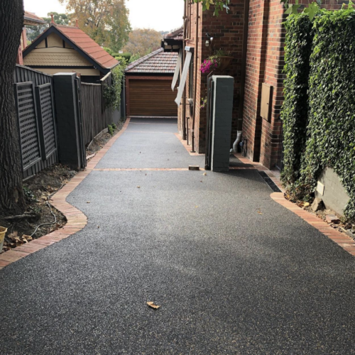 Paver colour “Midnight Gold” permeable paving with old red brick borders for a heritage brick home