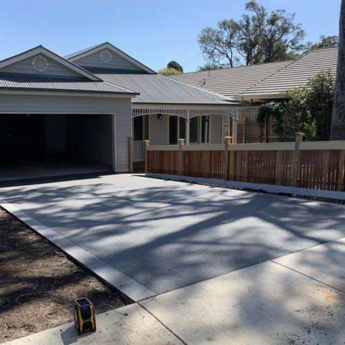 Driveway using permeable paving in colour “Silver Ash” permeable paving with a bluestone border.